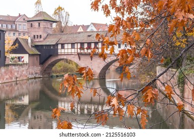 Nuremberg Landmark. Medieval Houses And Bridge Over Canal With Autumn Trees. Old Town Of Nuremberg, Germany. Tranquil Autumn Landscape In Old Town. Fall Season In Historical Downtown.