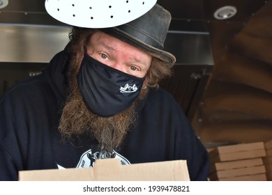 Nurmijarvi, Finland -03-19-2021: Finnish Actor, Ville Haapasalo Is Posing In His Food Truck. Food Truck Is Selling Georgian Traditional Food: Khachapuri