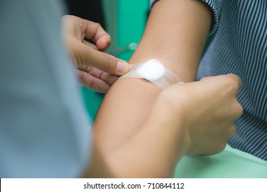 Nurse Is Applying The Bandaid To Cover The Wound Or Give A Pressure To Stop Bleeding