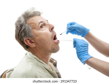 nurse applying iodine solution into patient mouth