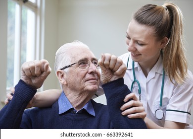 Nurse Assessing Stroke Victim By Raising Arms