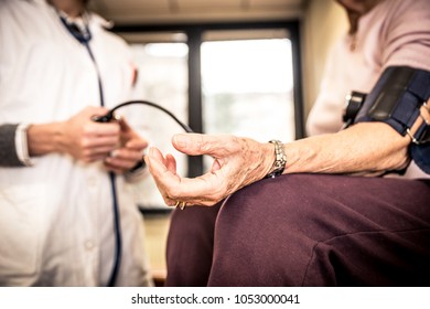 Nurse Assisting Patient In An Hospice