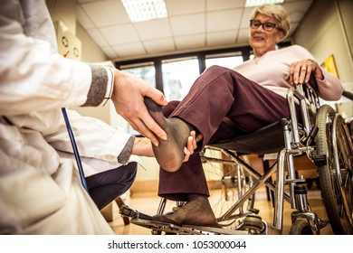 Nurse Assisting Patient In An Hospice