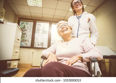 Nurse Assisting Patient In An Hospice