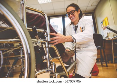 Nurse Assisting Patient In An Hospice