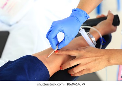 A Nurse Attending To A Blood Donor.Needle For Blood Donation. Medical Equipment For Blood Donor At Donation, Transfusion. Blood Donor And Nurse Hand.selective Focus