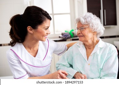 Nurse Attending Senior Woman In A Long Term Care Facility, Concept Of Trust Between Medical Staff And Home Occupants
