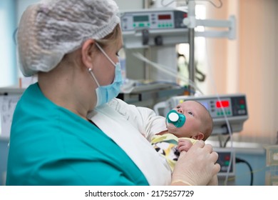 Nurse with a baby in intensive care. Newborn baby in the hospital. - Shutterstock ID 2175257729