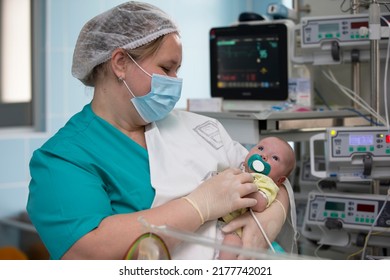 Nurse with a baby in intensive care. Newborn baby in the hospital. - Shutterstock ID 2177742021