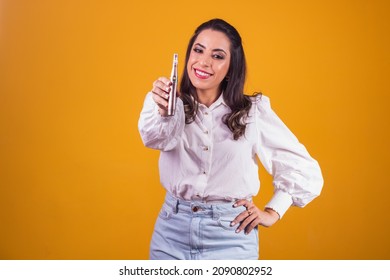 Nurse And Beautician Holding A Dermapen For Lip Hydration On Yellow Background.