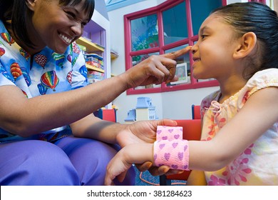 Nurse caring for girl