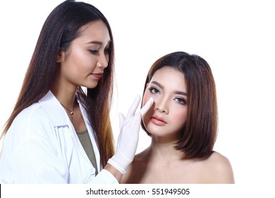 Nurse Check Woman's Face Who Want To Do Eye, Nose, Eyebrow, Forehead, Cheek, Jawline Before Plastic Surgery, Studio Lighting White Background Copy Space For Text Logo