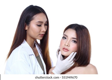 Nurse Check Woman's Face Who Want To Do Eye, Nose, Eyebrow, Forehead, Cheek, Jawline Before Plastic Surgery, Studio Lighting White Background Copy Space For Text Logo