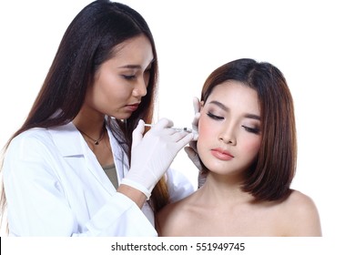 Nurse Check Woman's Face Who Want To Do Eye, Nose, Eyebrow, Forehead, Cheek, Jawline Before Plastic Surgery, Studio Lighting White Background Copy Space For Text Logo