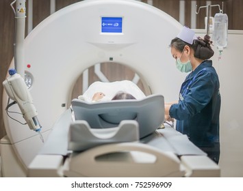 Nurse Checking Patient Vital Sign After Inject Contrast Media In CT Scan Room