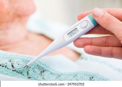 Nurse Checking Sick Patient's Body Temperature - Fever.