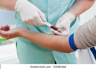 Nurse collecting a blood from a patient