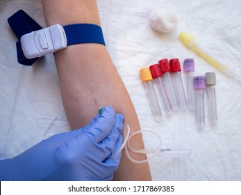 Nurse collecting a blood and urine sample for analysis