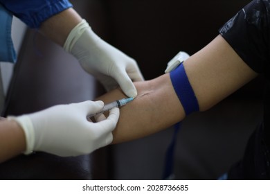 Nurse Collects Blood Specimen From Vein At Elbow Bend