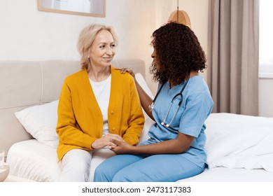 Nurse Comforting Elderly Woman In Hospital Room. Medical Staff Providing Care And Support. Healthcare. Compassionate Nursing And Patient Interaction. Caring Environment And Professional Assistance. - Powered by Shutterstock