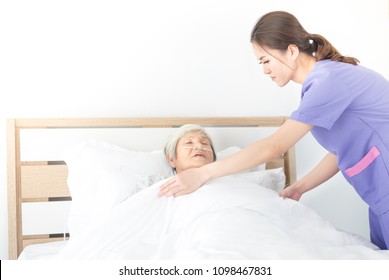 Nurse Cover Blanket To Old Asian Patient , Elderly Health Care , Palliative Care