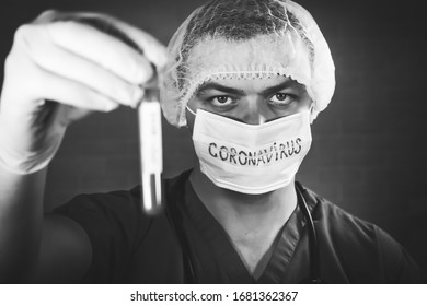 The nurse / doctor shows the stop coronavirus sign. A young doctor in medical uniform with a protective face mask and a gloved hand showing a stop sign - Stop coronavirus, covid-19. 