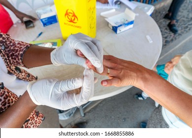 Nurse does a quick malaria test from blood on the South Africa and Mozambique border