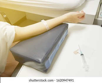 Nurse Drawing Blood A Patient By Syringe