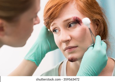 Nurse Dressing The Wound Above The Eye
