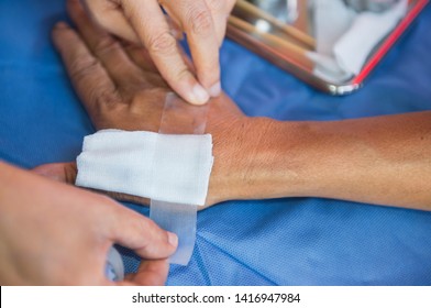 Nurse Dressing Wound Hand.Hand With Gauze ,plastered In The Hospital - Image