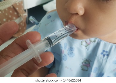  Nurse Is Entering Medicine Sick Child By Syringe