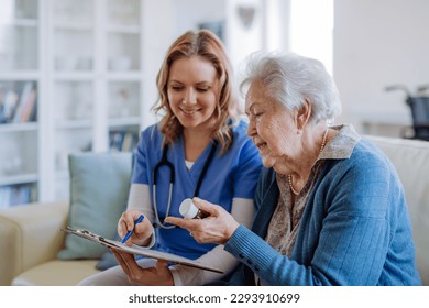 Nurse explaining how to dose medicines to senior woman. - Powered by Shutterstock