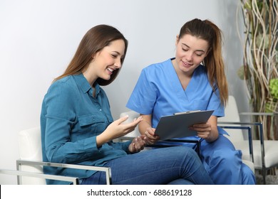 Nurse Explaining Medical Procedure To A Patient In A Waiting Room