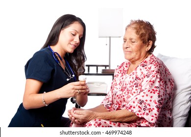 Nurse Explaining Prescription Medication To Senior Patient, Home Medical Health Concept.