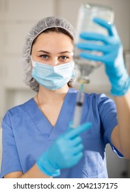 Nurse Fills A Syringe With Injection Solution