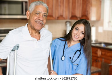 Nurse Giving Care To An Elderly Patient At Home