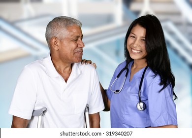 Nurse giving physical therapy to an elderly patient