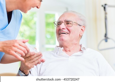 Nurse giving senior man prescription drugs - Powered by Shutterstock