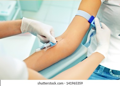 The Nurse Is Going To Loosening A Tourniquet During The Injection