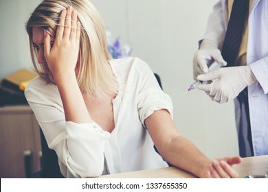 Nurse Hand With Syringe Needle And Woman Fear Of Injections Phobia Concept Against 