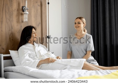 Similar – Female doctor comforting older patient