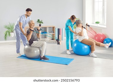 Nurse or health care workers helping senior patients to do sport stretching exercises with rubber band and fit ball in rehabilitation clinic. Physiotherapist helping elderly man and woman in rehab. - Powered by Shutterstock