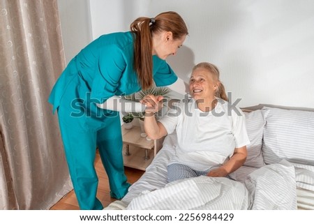 Similar – Caregiver auscultating senior woman