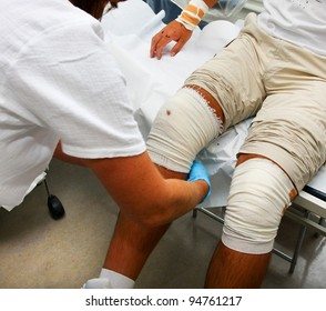 Nurse Helping Patient With Wounded Knee