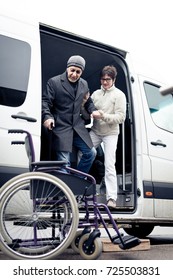 Nurse Helping Senior Man Exit A Van