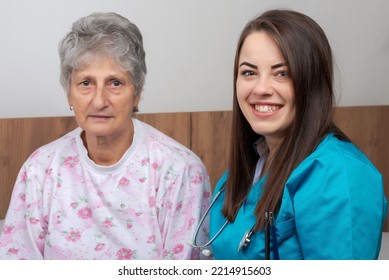 Nurse helping senior woman in hospital - Shutterstock ID 2214915603