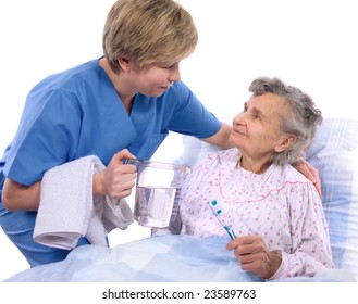 Nurse Helps The Senior Woman In Washing