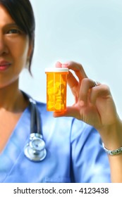 Nurse Holding Bottle Of Prescription Pills