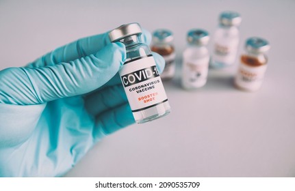 The Nurse Holding The Covid Vaccine Booster Shot In Hand