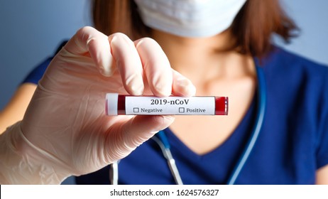 Nurse Holding Test Tube With Blood For 2019-nCoV Analyzing. Novel Chinese Coronavirus Blood Test Concept.